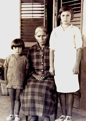 The two children are Maria's grand-daughters.  Their mother is Guillermina Gomes, born at Monte, Madeira, Portugal.  One of the children is named Marita.